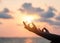 Mantra yoga meditation practice with silhouette of woman in lotus pose having peaceful mind relaxation on the beach outdoor