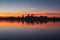 Mantua old city skyline silhouette reflecting in the waters of Lower Lake during sunset