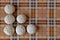 Manty on a checkered yellow-brown tablecloth. Food