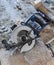 manual circular saw is on a wooden board in house under construction of foam block