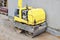 Manual compact asphalt roller for tamping soil at a construction site