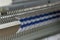 Manual knitting machine. A knitting machine is a device used to create knitted fabrics