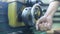 Manual steering on an adjustable wheel on a mini lathe. A worker sets up a lathe, close-up.