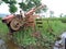 A manual tractor made of steel for plowing rice fields used to prepare land for rice cultivation.