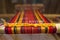 Manual wood loom. Hand loom background. Detail of traditional vintage weaving hand loom with wool close up. Vintage