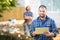 Manual Worker Holding Digital Tablet With Coworker