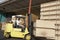 Manual Worker Operating Forklift Truck In Lumber Industry