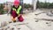 Manual Worker Using Hammer at Construction Site