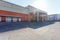 Manufacture building of modern waste recycling processing plant in orange style. Separate garbage collection. Recycling and