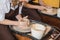 The manufacture of ceramics. Two woman prepare clay for work on pottery wheel. Close up view of hands.