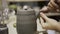 The manufacture of ceramics. Woman working with clay on pottery wheel