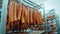 Manufacture of sausages in the meat industry or in a butcher`s shop. Rows of raw, smoked, beef, pork, veal meat and