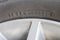 Manufactured date and Tire size symbol on the rubber car wheel.