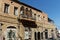 Many air conditioners on a balcony with blue sky. Old Jaffa, Tel Aviv, Israel. Aircos for cooling on a warm city day