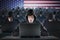 Many American hackers in troll farm. Security and cyber crime concept. USA flag in background.