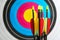 Many arrows against archery target, closeup view. Space for text