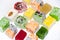 Many assorted multicolored Turkish Delight on white background