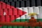 Many barrels with flag of Jordan and oil pipe. 3d rendering