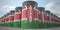 Many barrels with flag of Kenya. Oil or chemical industry supply related 3D rendering