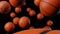 Many basketball balls on black background.