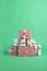 Many beautifully wrapped gift boxes on green background