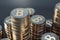 Many Bitcoin coins stacks on dark grey background, cryptocurrency and mining concept, closeup. 3D rendering