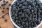 many blackberries in a metal bowl