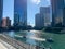 Many boats of all sizes on the Chicago River on a bright, sunny summer afternoon