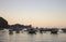 Many boats in tropical harbor in the evening. Sunset in lagoon in Philippines,Palawan, El Nido. Traditional philippines sailboats.