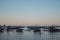 Many boats in tropical harbor in the evening. Sunset in lagoon in Philippines,Palawan, El Nido. Traditional philippines sailboats.