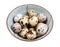 many boiled quail eggs in ceramic bowl cutout