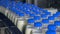 Many bottles of milk on a conveyor belt at milk production plant.