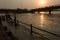 Many boys going to jump into ganga river for relief of heat in summer at sunrise at haridwar bridge temple sky