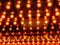 Many bright glowing glass lamps. Illumination of set Edison retro lamps on dark rabitz background. Fashionable loft