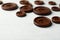 Many brown sewing buttons on wooden background, closeup
