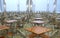 Many brown square eating tables and metal chairs staying in empty cafe hall