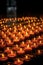 Many burning candles with shallow depth of field. AI generated