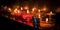 Many burning candles with shallow depth of field. AI generated