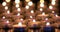 Many candles burning with shallow depth of field