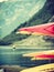 Many canoes on norwegian fjord shore