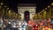 Many cars on night crowded street of Arc de Triomphe, Arch of Triumph Paris city lights