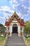 Many chicken statues in the temple have a backdrop of sky and beautiful natural clouds