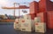 Many chinese cargo containers and cardboard boxes. Importing goods from China concept. 3D rendered illustration.