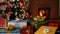 Many christmas gifts in front of fireplace and blurry lights on xmas tree