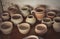 Many clay pot is on the table in pottery