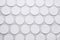 Many clean cotton pads on light grey background, flat lay