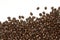 Many coffee beans on white background