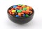 Many Colored Chocolate Candies in Black Bowl