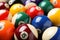 Many colorful billiard balls as background, closeup