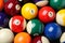 Many colorful billiard balls as background, top view